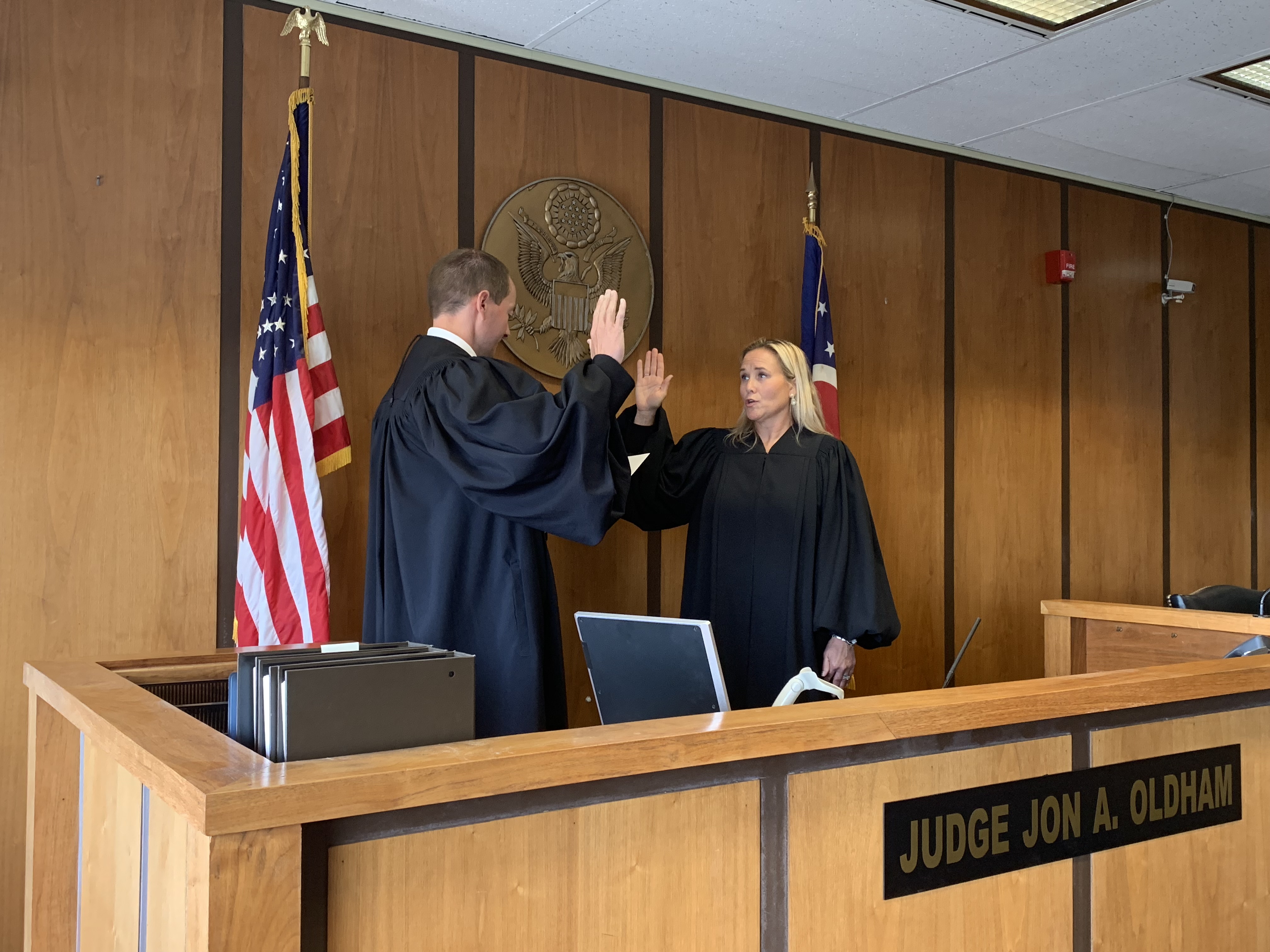 Akron Municipal Court Administrative/Presiding Judge Jon Oldham administers the oath for Visiting Magistrate Jennifer D. Towell